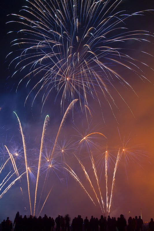 Crowds of people viewing a firework show